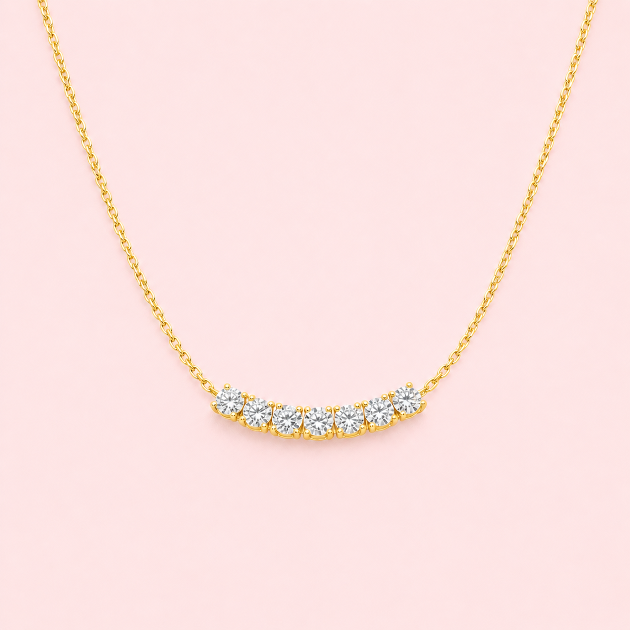 Lab-grown diamond curved bar necklace in 18ct yellow gold, seven round brilliant F VS diamonds, 1.20ct total, made to order at Fogal & Barnes Harrogate