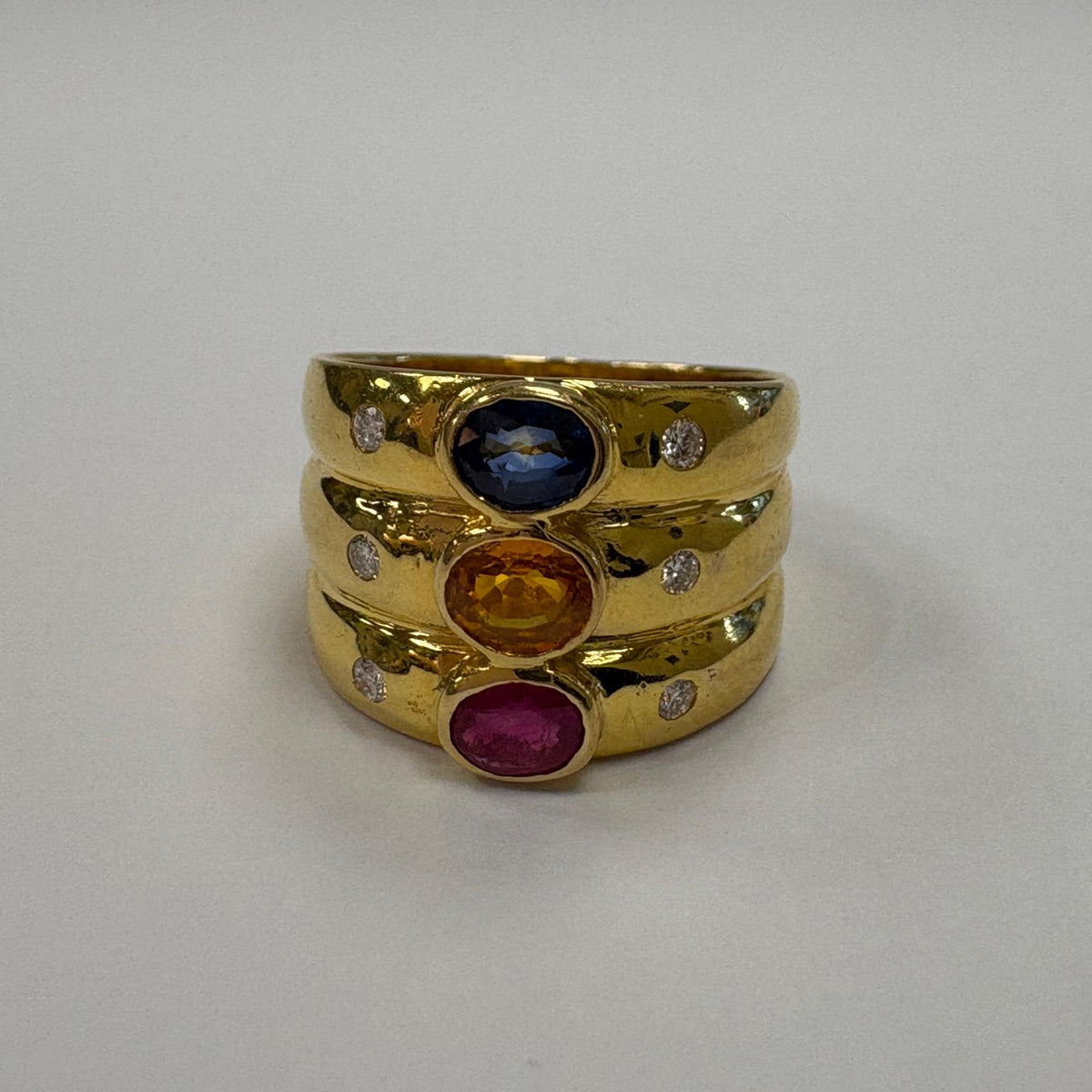 multi gem ring, ruby sapphire citrine ring, 18ct gold statement ring, triple band ring UK, wide gold gemstone ring, cocktail ring gold, pre-loved gemstone ring, birthstone family ring