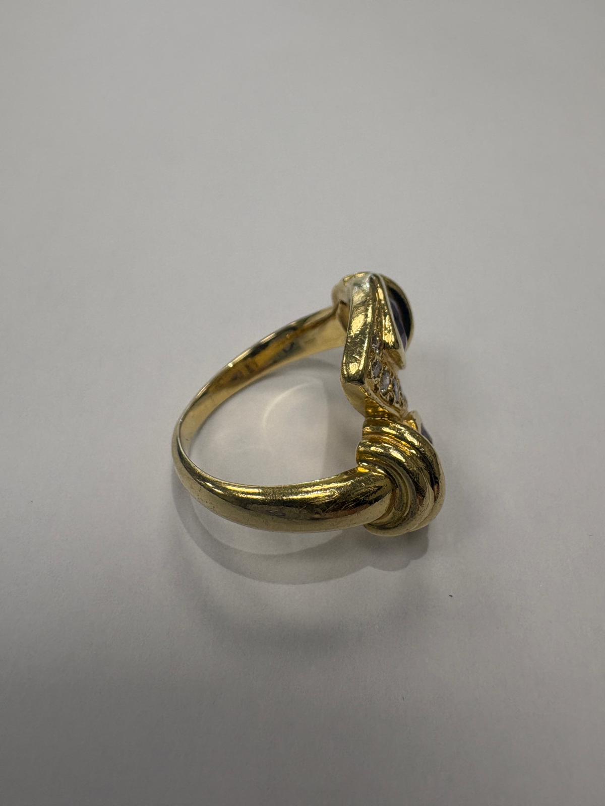 750 hallmark and MD maker's mark inside pre-loved 18ct yellow gold amethyst diamond toi et moi ring