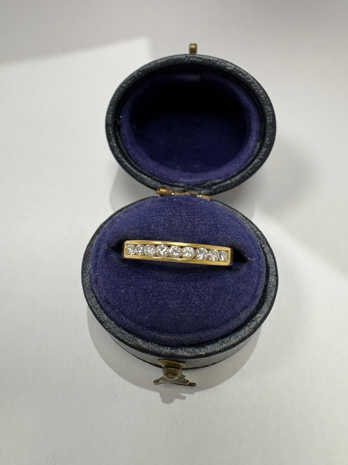 18K hallmark on pre-loved 18ct yellow gold channel-set diamond half eternity ring