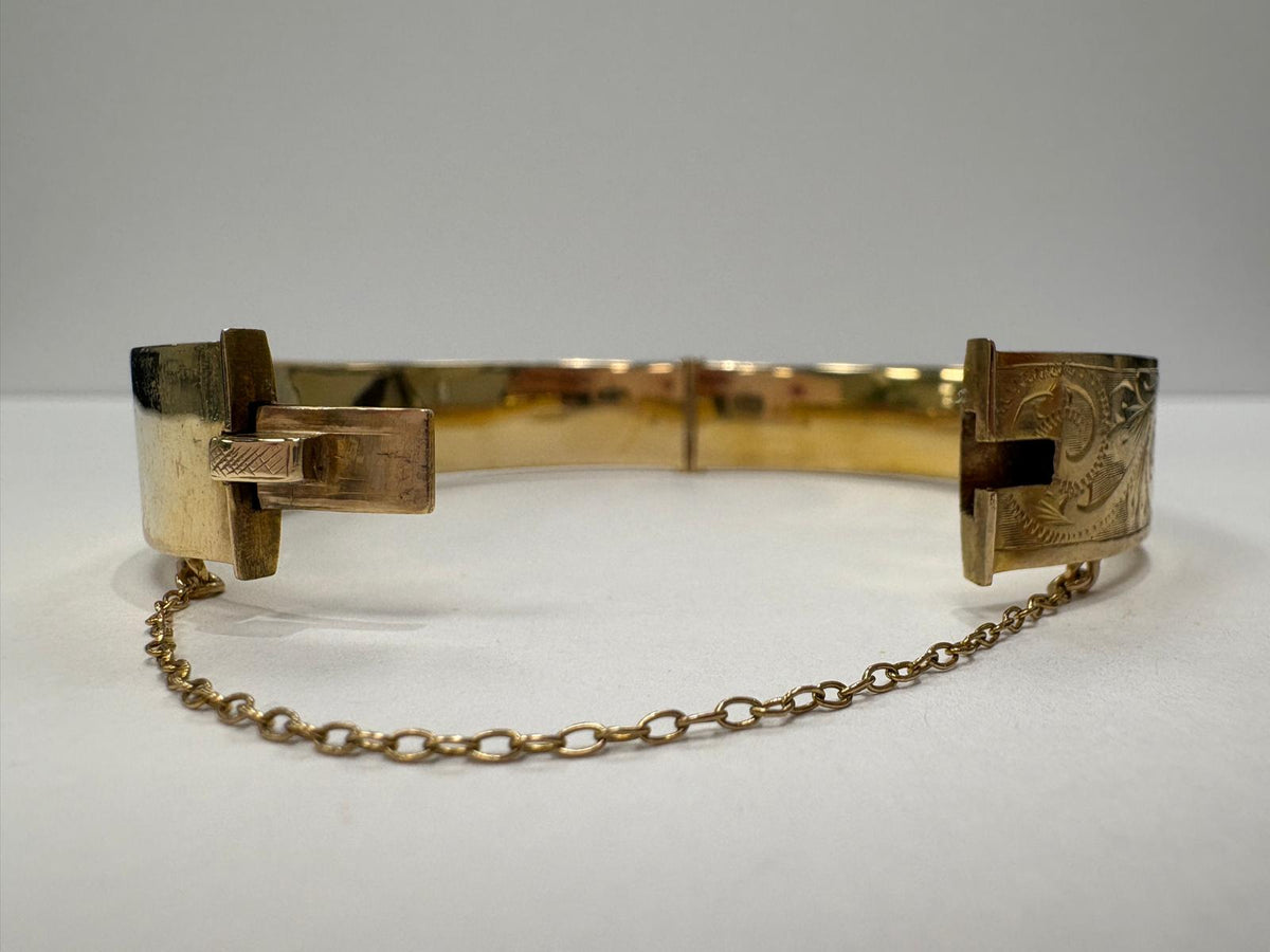pre-loved gold bangle, vintage engraved bangle, second hand 9ct gold bangle UK, antique style hinged bangle, pre-owned gold jewellery, Victorian style bangle, vintage bangle for sale UK, second hand fine jewellery UK, hand engraved gold bangle