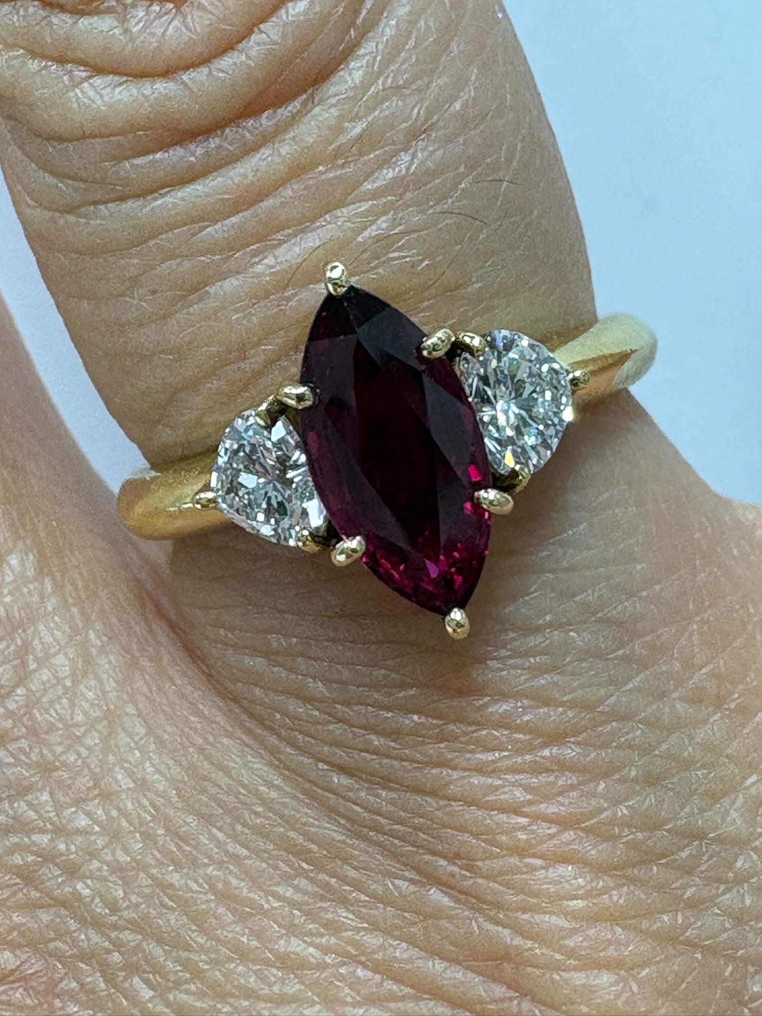 pre-loved ruby ring, second hand 18ct gold ring UK, GIA certified ruby ring, three stone ruby diamond ring, marquise ruby ring, pre-owned fine jewellery UK, heart diamond ring, second hand fine jewellery UK, certified ruby engagement ring