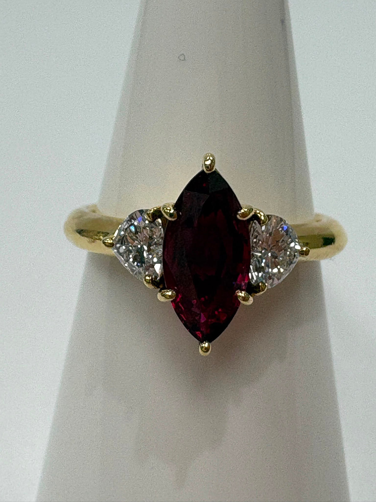 pre-loved ruby ring, second hand 18ct gold ring UK, GIA certified ruby ring, three stone ruby diamond ring, marquise ruby ring, pre-owned fine jewellery UK, heart diamond ring, second hand fine jewellery UK, certified ruby engagement ring