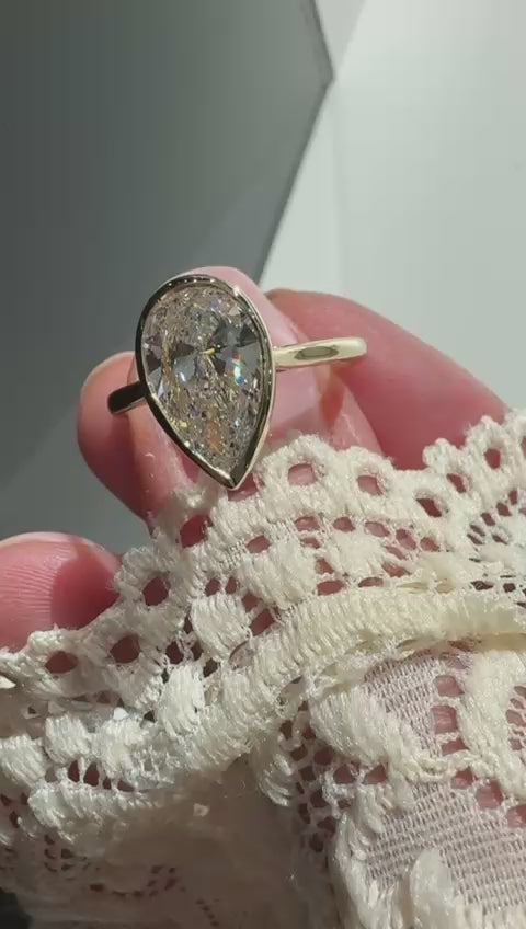 Lab-grown diamond engagement ring pear shape bezel yellow gold Harrogate Jewellers 
