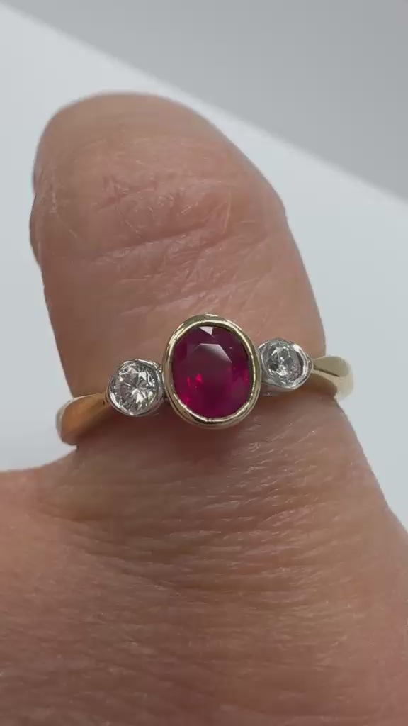 Oval ruby and diamond bezel set 9k two tone gold ring second hand jewellers uk Fogal and barnes 
