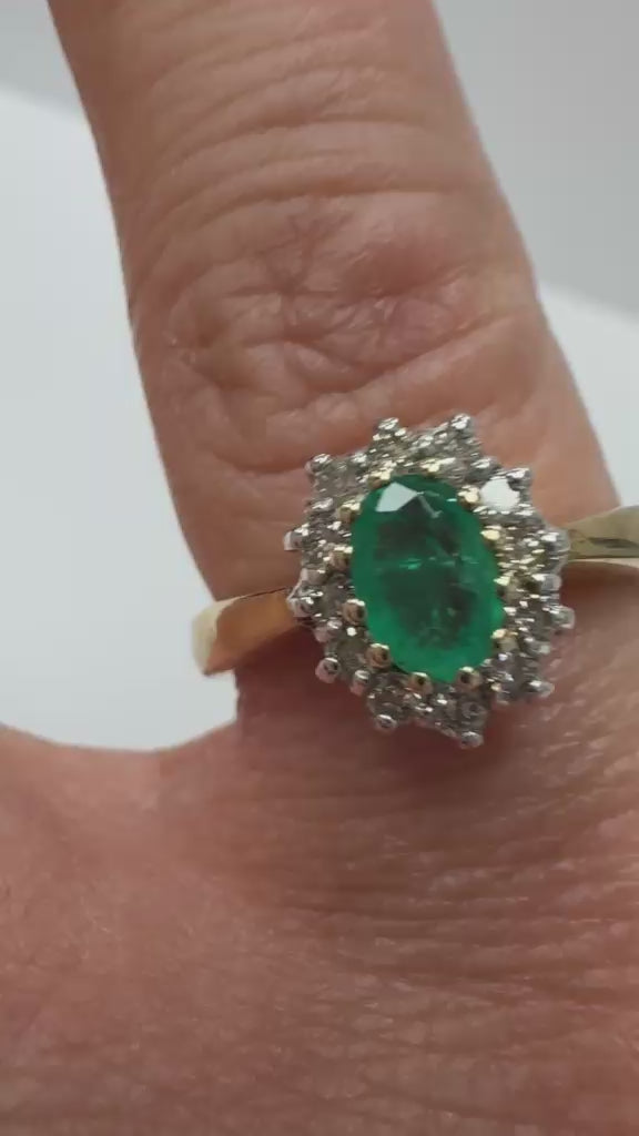 Second hand oval emerald and cluster diamond set on 9k yellow gold, perfect for a gift or engagement ring, Harrogate Jewellers UK 