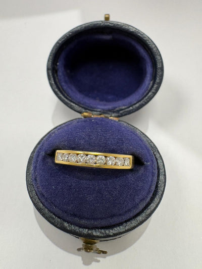 18K hallmark on pre-loved 18ct yellow gold channel-set diamond half eternity ring