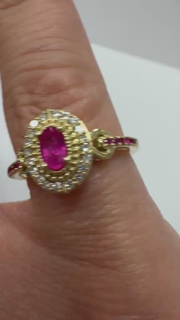 Second hand Oval Ruby with double diamond halo and ruby shoulders, unqiue vintage ring, from fogal and barnes harrogate Jewellers UK 