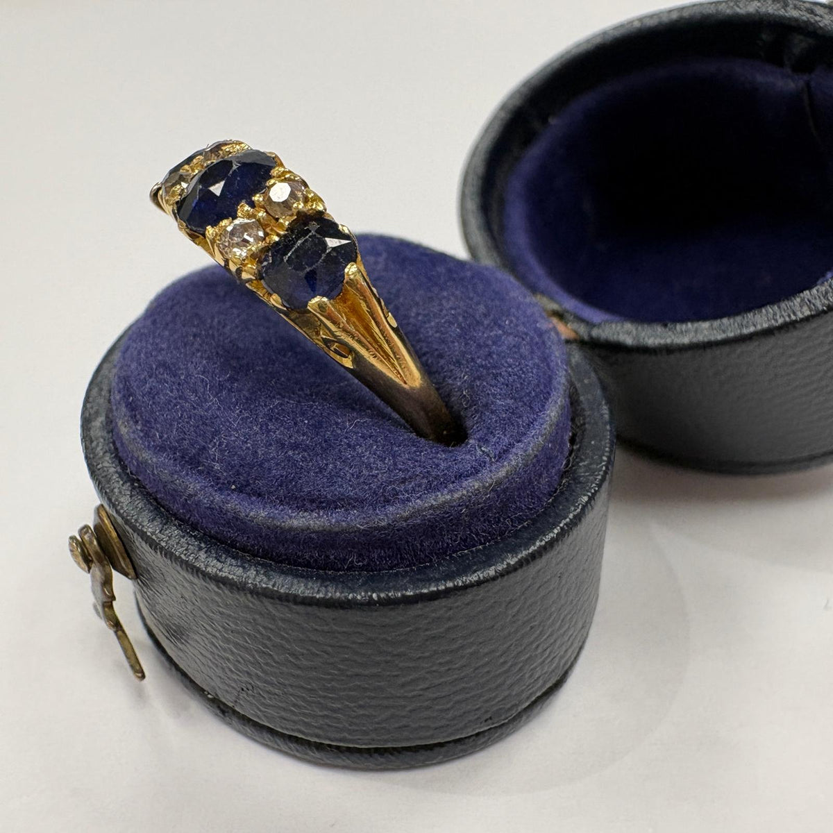 sapphire half hoop ring, carved half hoop ring, antique sapphire ring UK, sapphire and diamond ring, Edwardian sapphire ring, 18ct gold sapphire ring, alternative engagement ring, three stone sapphire ring