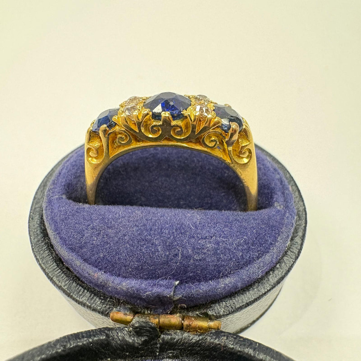 sapphire half hoop ring, carved half hoop ring, antique sapphire ring UK, sapphire and diamond ring, Edwardian sapphire ring, 18ct gold sapphire ring, alternative engagement ring, three stone sapphire ring