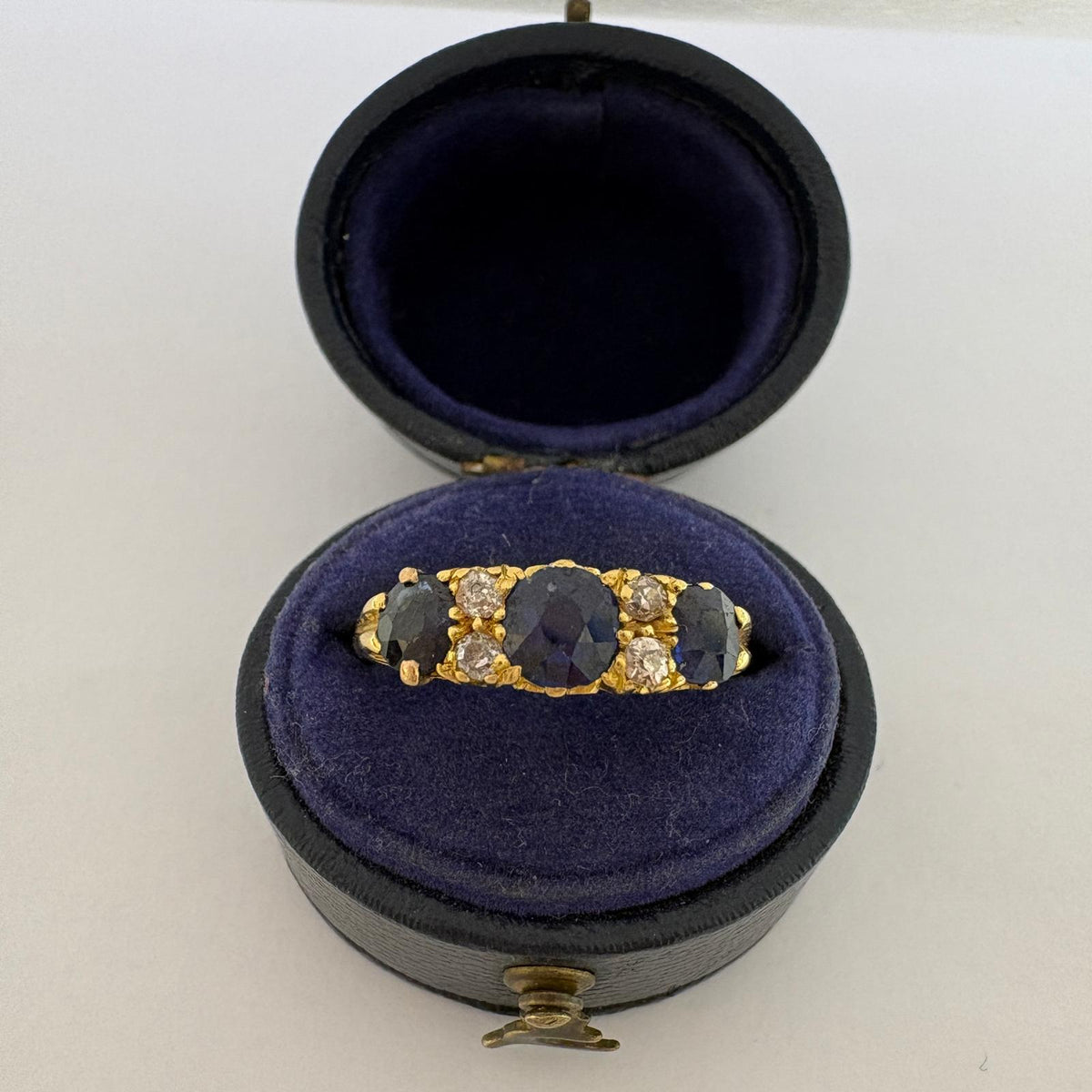 sapphire half hoop ring, carved half hoop ring, antique sapphire ring UK, sapphire and diamond ring, Edwardian sapphire ring, 18ct gold sapphire ring, alternative engagement ring, three stone sapphire ring