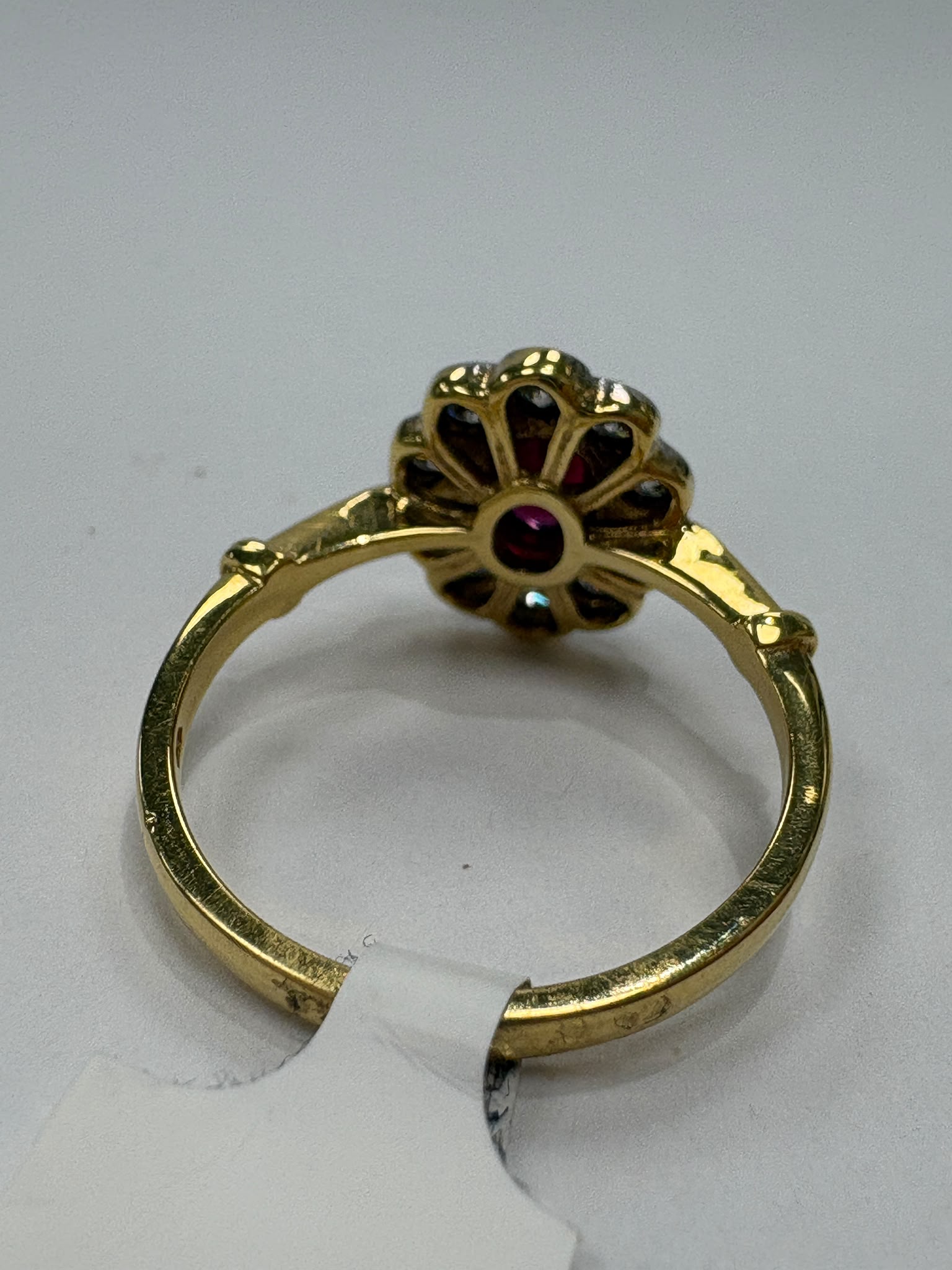 vintage ruby diamond ring, 18ct gold ruby cluster ring, oval ruby ring, ruby engagement ring alternative, pre-loved ruby ring UK, vintage cluster ring Harrogate, diamond halo ruby ring, second hand ruby ring size N