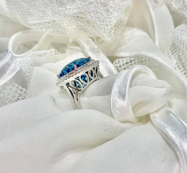 BLUE TOPAZ AND DIAMOND RING