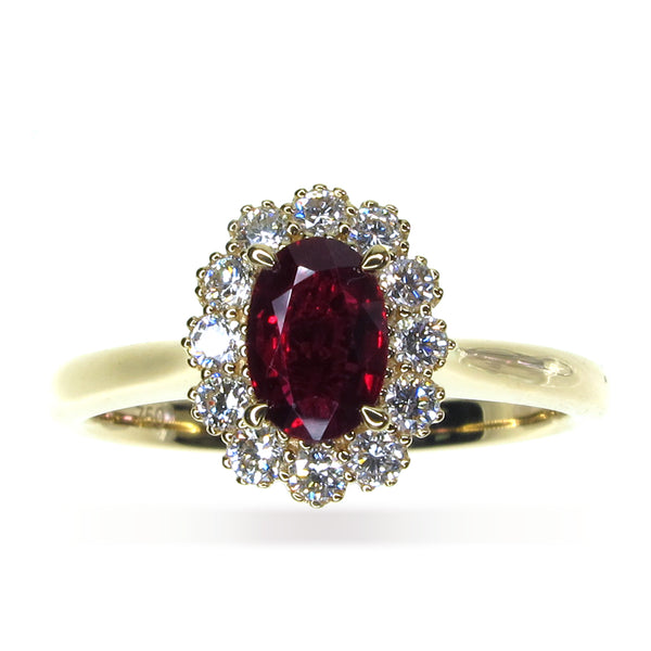 Intense oval Ruby and diamond cluster engagement ring yellow gold Harrogate jewellers Fogal and barnes 