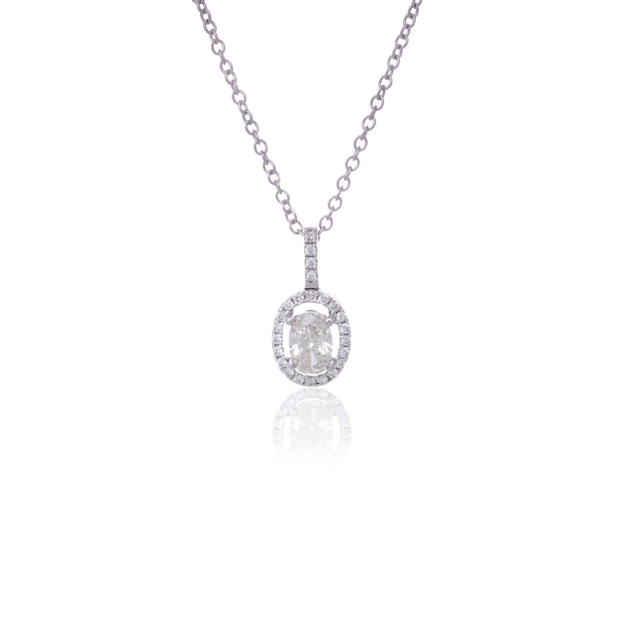 Classic oval cut diamond halo drop pendant necklace white gold Harrogate jewellers Fogal and barnes 