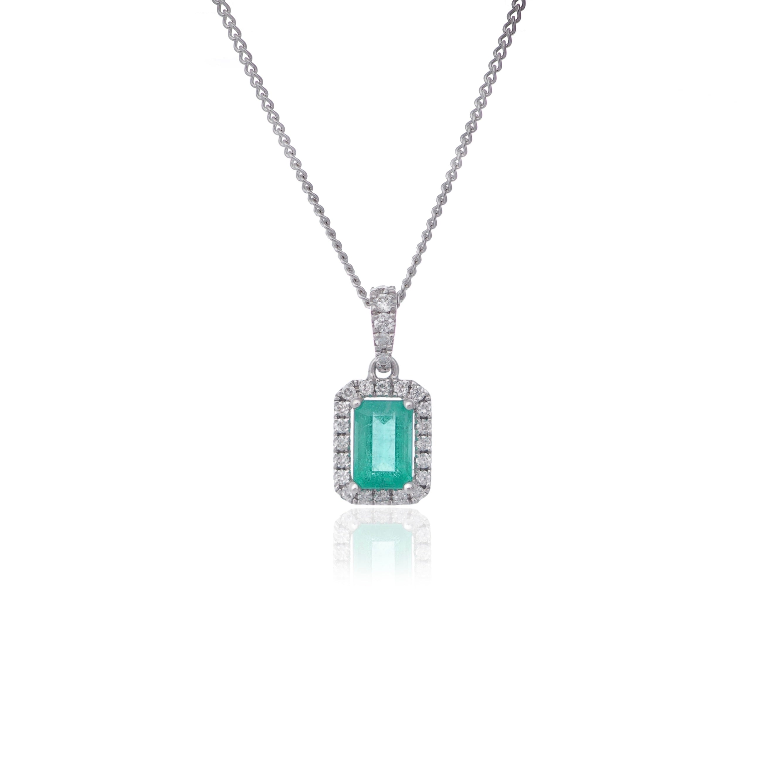 Emerald cut emerald and diamond pendant necklace white gold Harrogate jewellers Fogal and Barnes 
