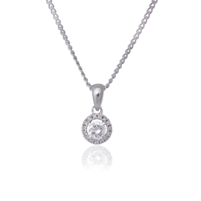 Round brilliant cut diamond with diamond halo pendant necklace white gold Harrogate jewellers Fogal and barnes 