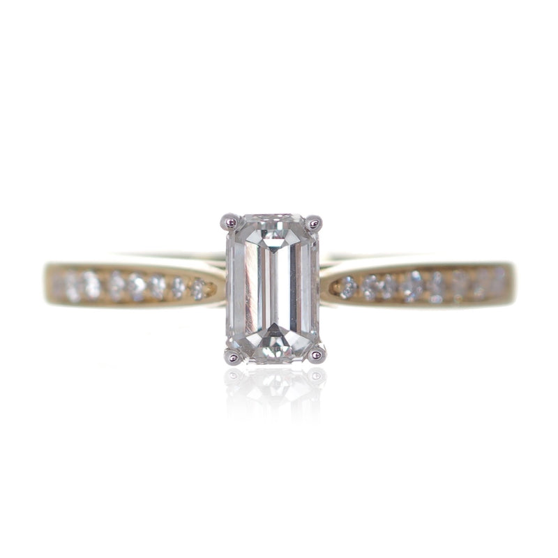 Emerald cut diamond solitaire engagement ring diamond shoulders yellow gold Harrogate jewellers Fogal and barnes 